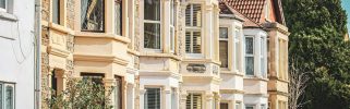 A row of Victorian houses with bay windows